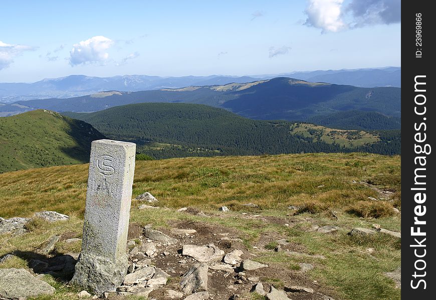 Old border Sign (1920) of  Czechoslovakia and Poland in Carpathian Mountains. Ukraine. Old border Sign (1920) of  Czechoslovakia and Poland in Carpathian Mountains. Ukraine