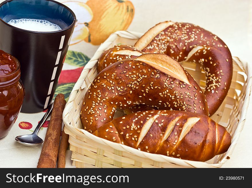 Rolls, jam and cup of milk are the full breakfast pleasure