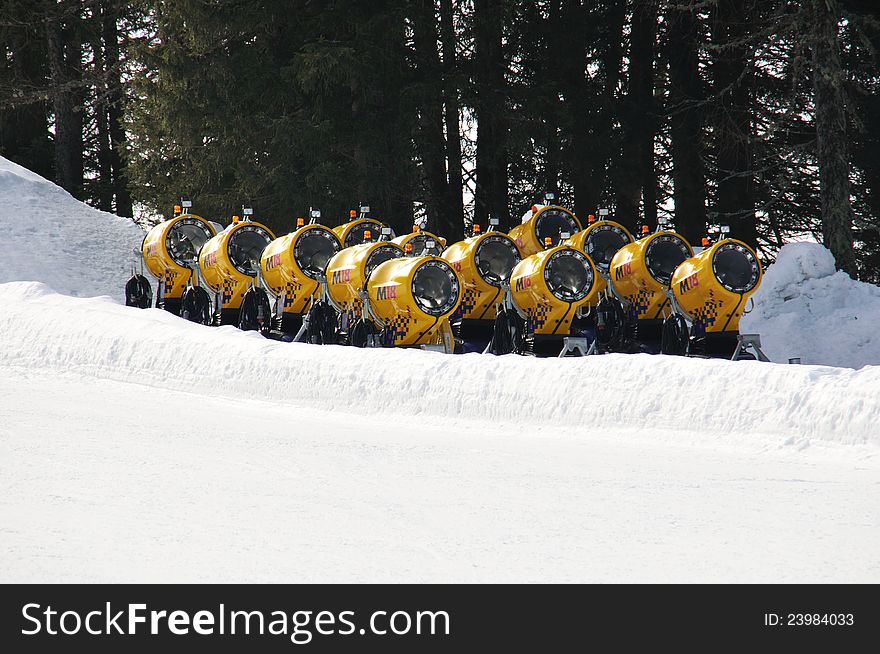 Snow cannons standing in a row
