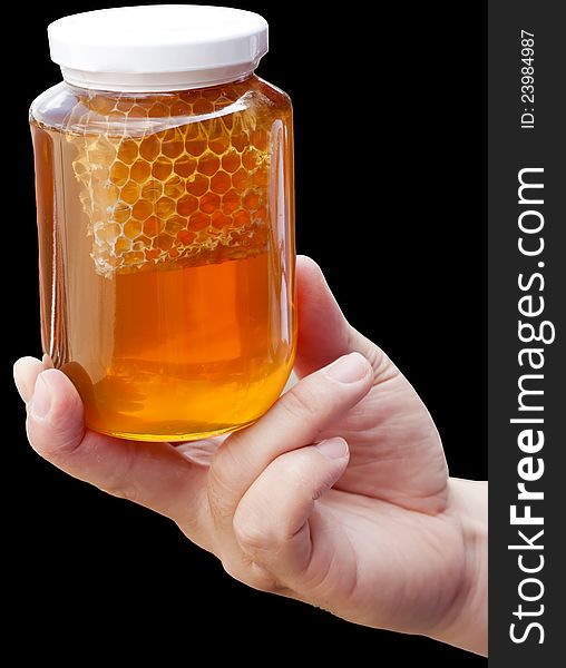 Natural floral honey in hand