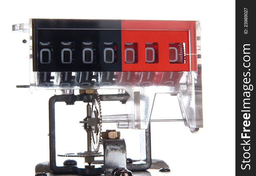 The mechanism of a mechanical counter with gears, isolated on a white background. The mechanism of a mechanical counter with gears, isolated on a white background.