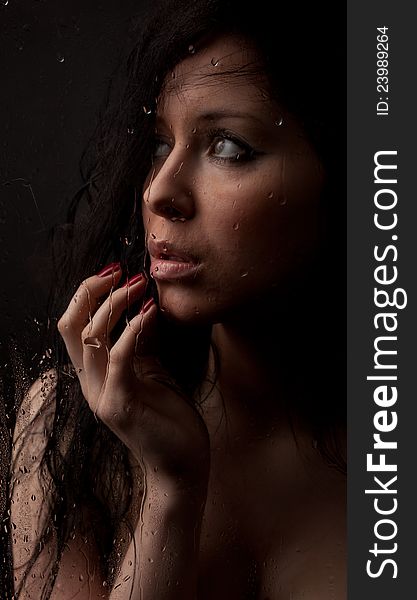 Naked Girl In A Wet Glass On A White Background