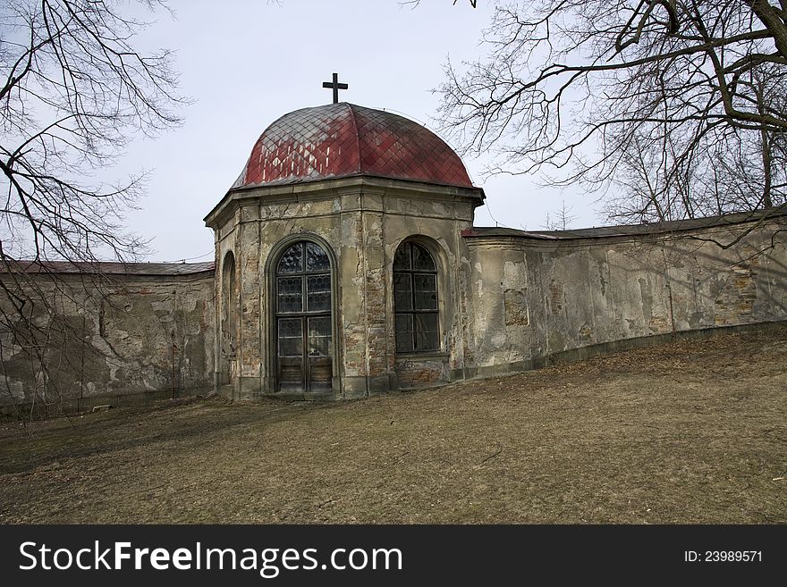 Chapel with glass windows, old chapel at the stone wall, chapel with a cross on the roof, chapel with red roof, chapel in the park in rychnov, chapel of the old facade