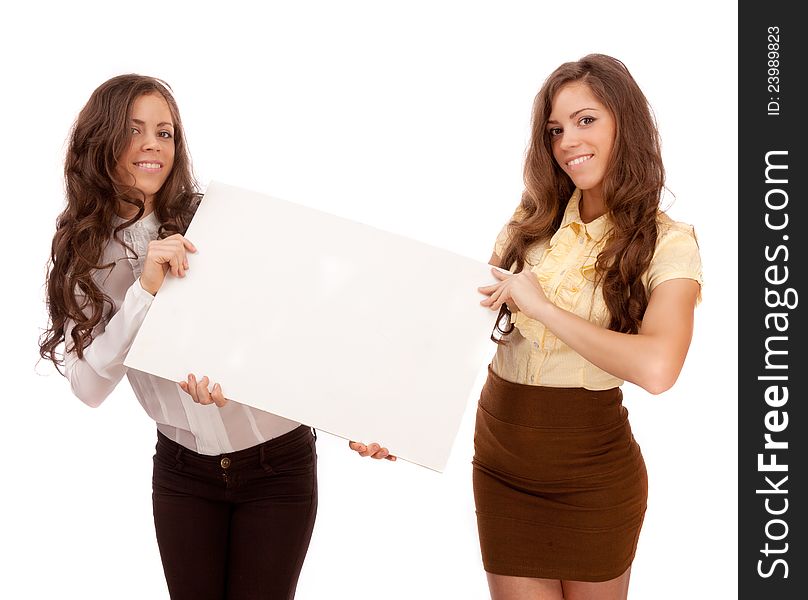 Gemini sisters hold a poster on a white background