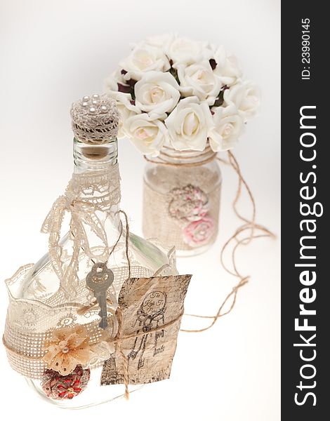 Bouquets and bottles on a white background. Ornaments in the form of ropes.