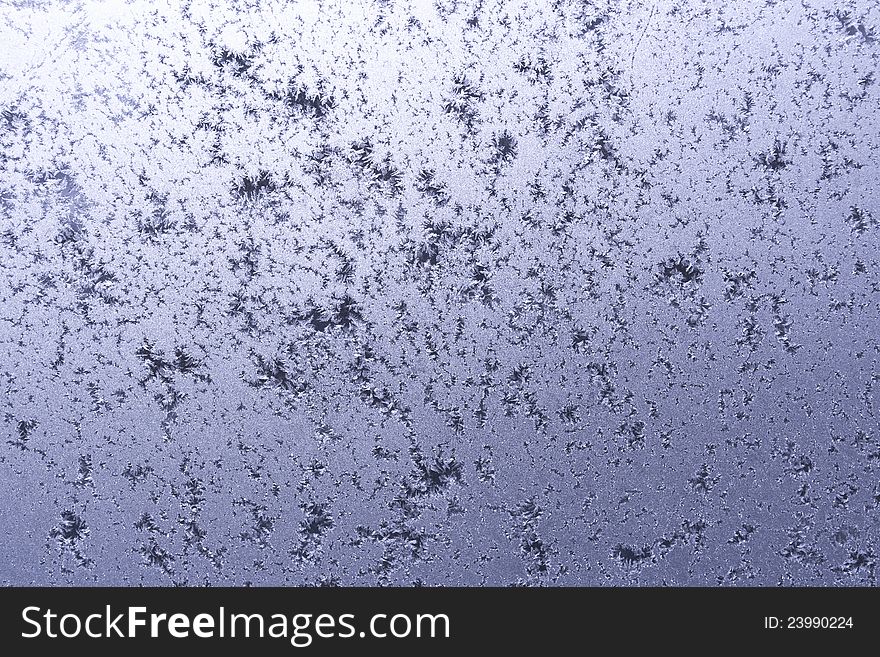 Frozen winter window with crystals of ice