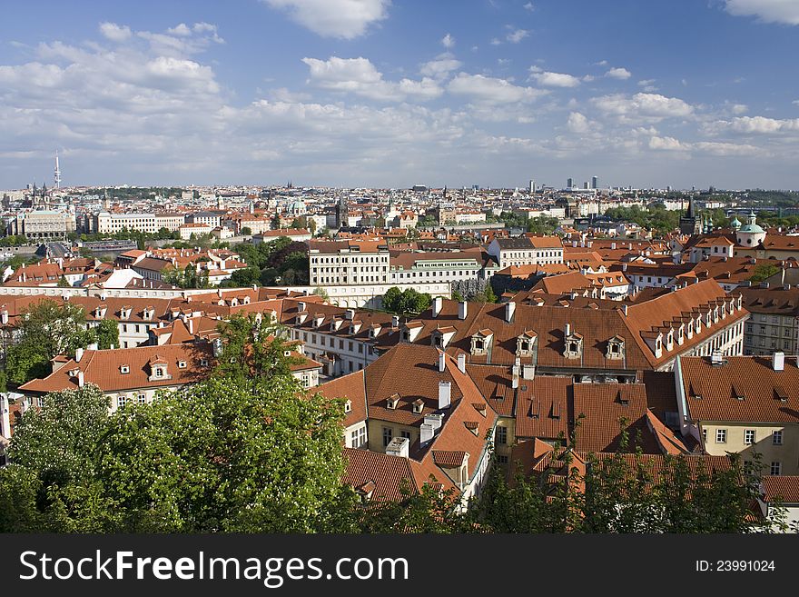 View of Prague, Prague in the summer, the city's houses with blue sky, green trees between dominant in Prague, the city of hundred towers. View of Prague, Prague in the summer, the city's houses with blue sky, green trees between dominant in Prague, the city of hundred towers