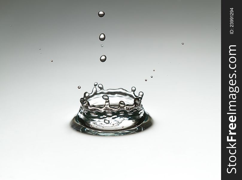 The drop, which falls into the water. Spray fly like a crown.