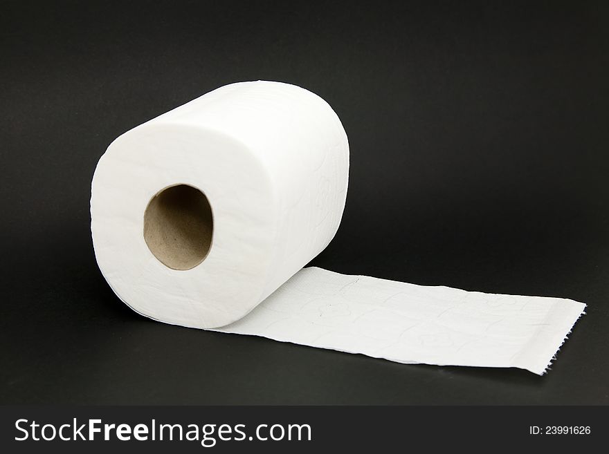 Toilet paper roll with the black background