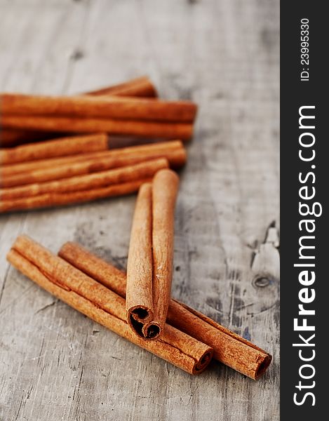 Bunch of cinnamon sticks on a wooden table