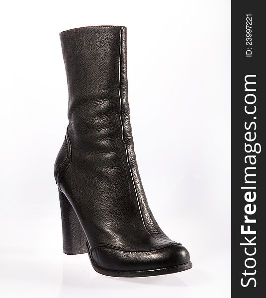 Black leather stylish woman boot over white backgroun. Black leather stylish woman boot over white backgroun