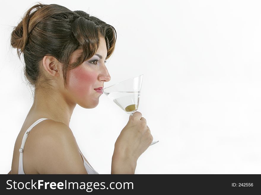 healthy woman with a glass of martini and an olive