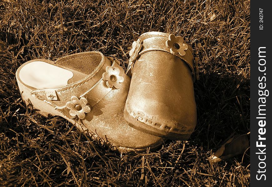 A pair of child shoes sepia. A pair of child shoes sepia