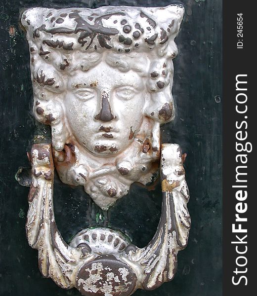 Ornate door knocker, southern Spain. Ornate door knocker, southern Spain.