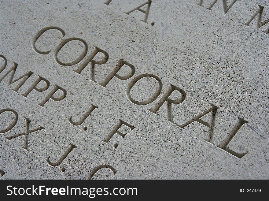 Inscription 'corporal' at a memorial site in Belgium for casualties of World War I. Shallow dof with focus on the f beneath the word corporal. Inscription 'corporal' at a memorial site in Belgium for casualties of World War I. Shallow dof with focus on the f beneath the word corporal.