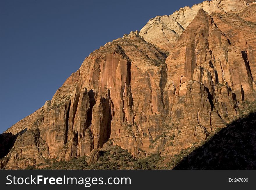 Canyon walls at Zion National Park lit by the sunset light. Canyon walls at Zion National Park lit by the sunset light