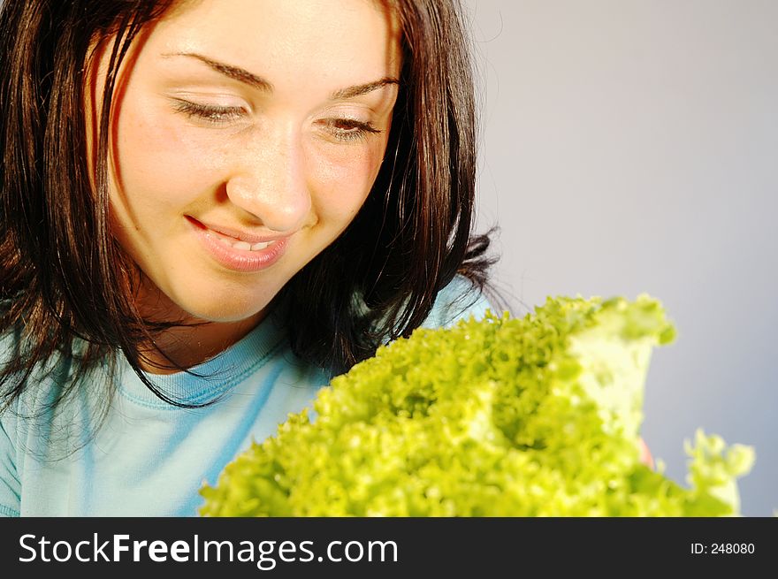 Beautiful girl holding a fresh salad. Beautiful girl holding a fresh salad