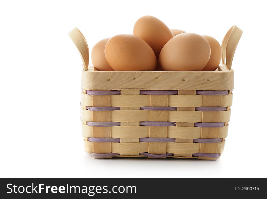 Basket of chicken eggs isolated over a white background