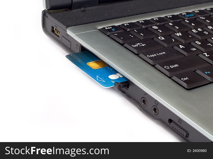 Credit card inserted in laptop