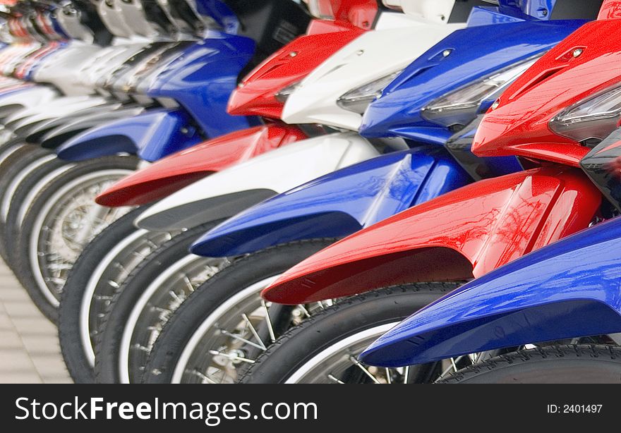 a long line of of moterbikes for sale