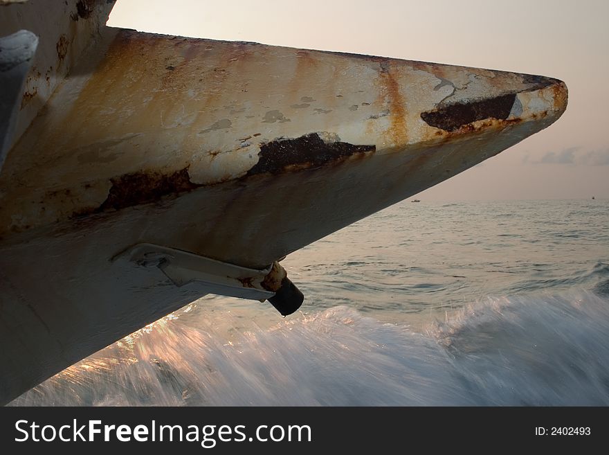 A million dollar sailboat yacht beached and shipwrecked along the coast of Florida in the Ocean. Here the front is shown close up. A million dollar sailboat yacht beached and shipwrecked along the coast of Florida in the Ocean. Here the front is shown close up.