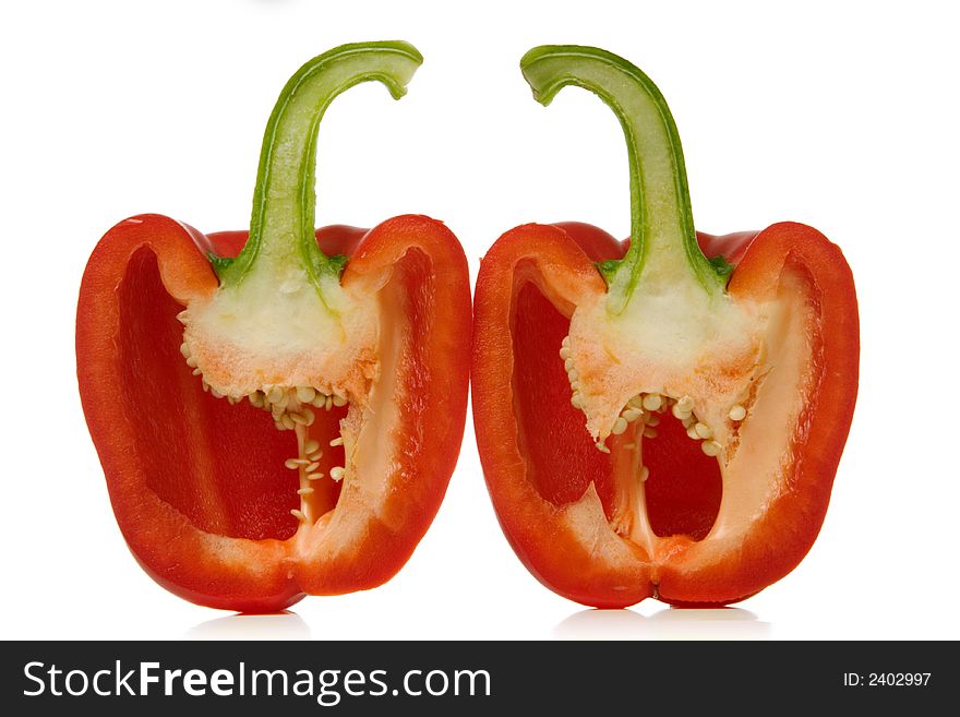 Red paprika sliced over white background