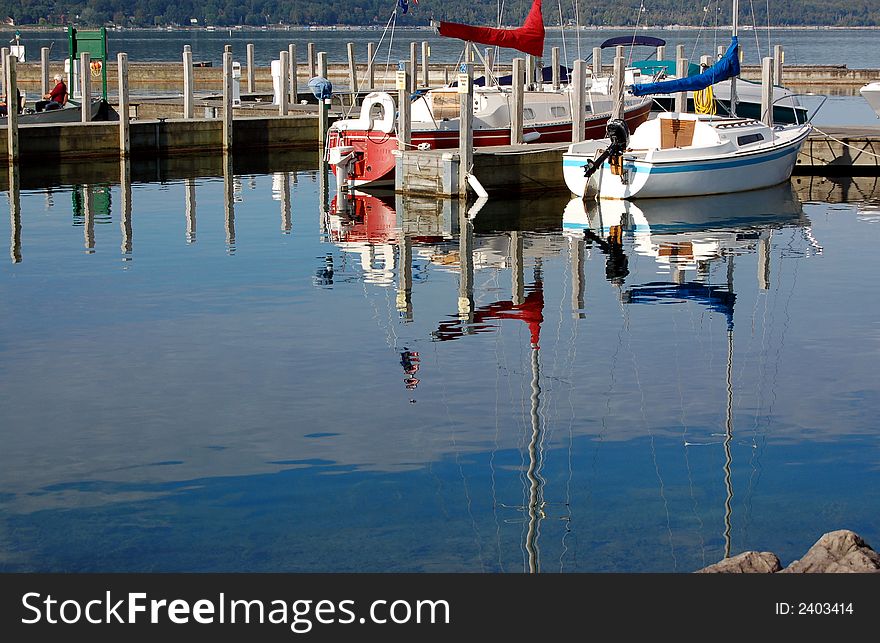 A bayside marina, with a great reflection off the lake. A bayside marina, with a great reflection off the lake.