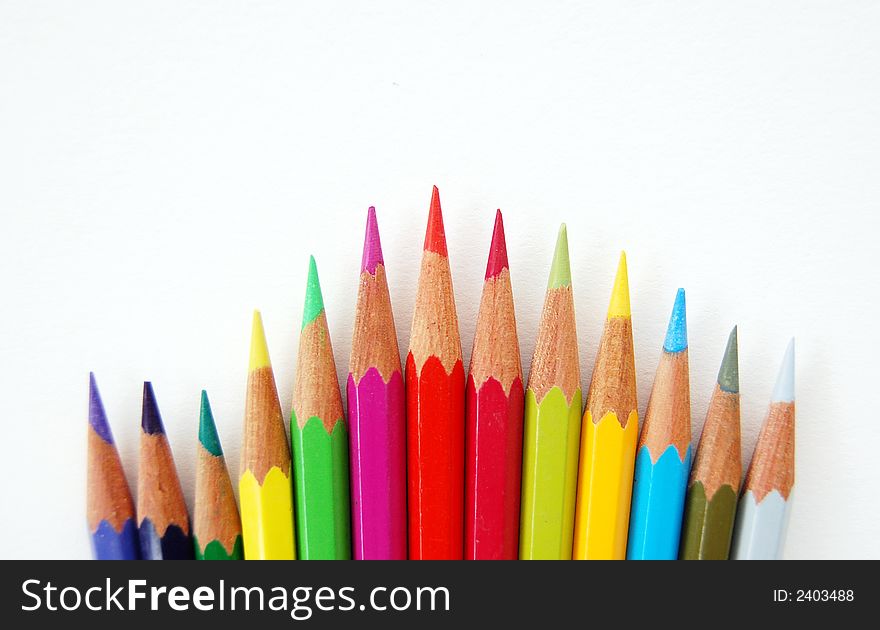 A variety of colored pencils over a white background, with clipping path included. A variety of colored pencils over a white background, with clipping path included.