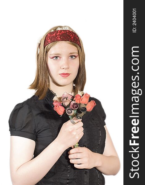 A pretty young woman in a black blouse holds a bunch of flowers. A pretty young woman in a black blouse holds a bunch of flowers