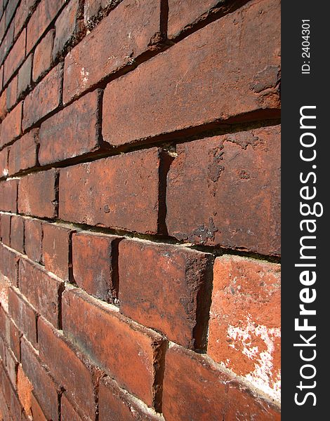 Close up perspective view of a brick wall with narrow DOF
