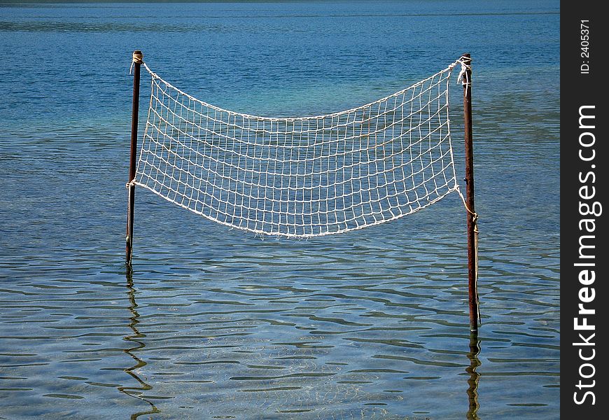 Volleyball net in the water. Volleyball net in the water