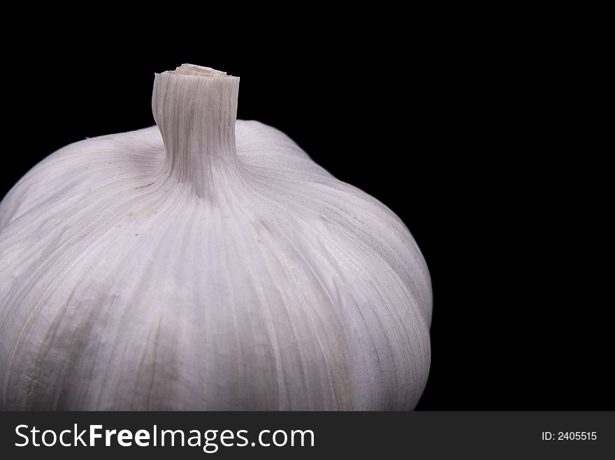 Close up view of Garlic on black background