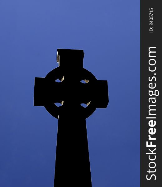 Silhouette of A Celtic Cross In An Irish Graveyard