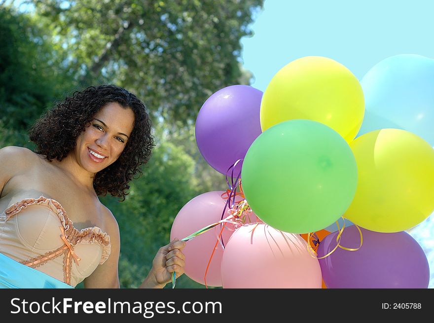 Beautiful birthday girl in a vintage dress with colorful baloons. Beautiful birthday girl in a vintage dress with colorful baloons