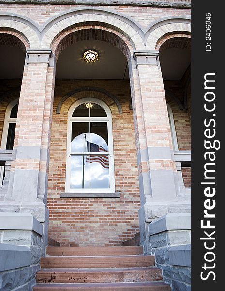Old building with a window with brick exterior. Old building with a window with brick exterior