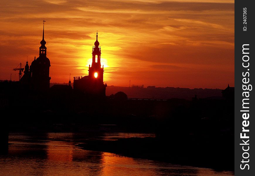 Beautiful view of the silhouette of dresden / germany during a very colourful and red shining sundown. my standpoint was of a bridge over a river.