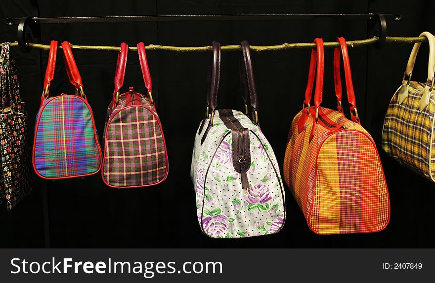 Modern bags hanging on a rack