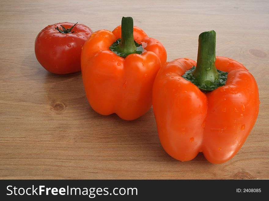 Fresh vegetables. Sweet orange peppers and tomato. Fresh vegetables. Sweet orange peppers and tomato.