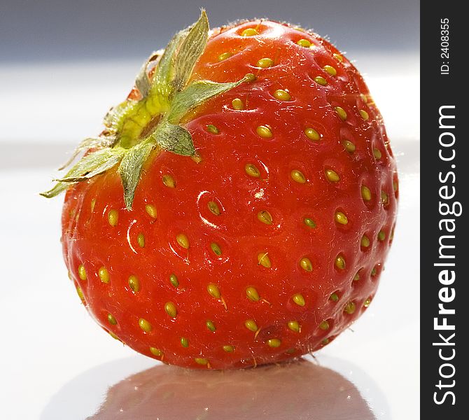 Macro close-up of a single strawberry