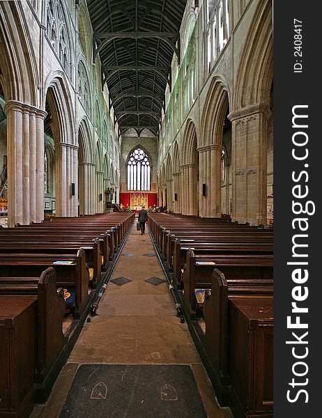 Interior of Bridlington Priory in UK -Vertical view with figure to give scale. Interior of Bridlington Priory in UK -Vertical view with figure to give scale