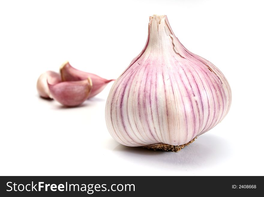 Garlic and cloves over a white background. Garlic and cloves over a white background