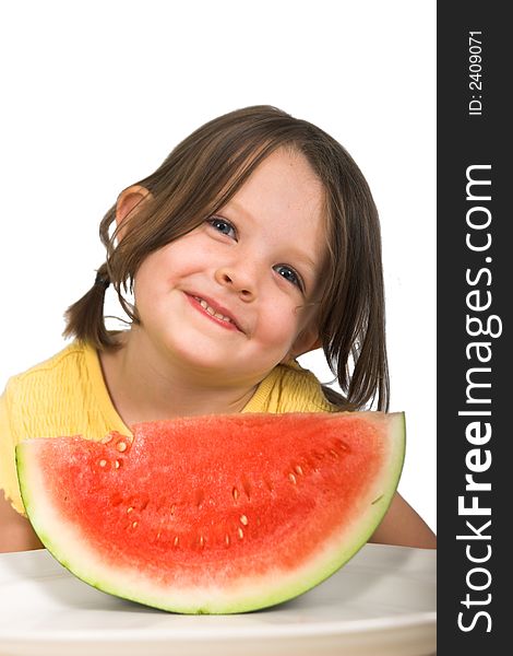 Little girl with delicious piece of watermelon, isolated over white. Little girl with delicious piece of watermelon, isolated over white