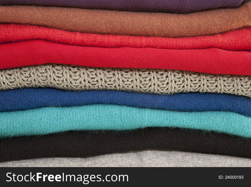 Folded Sweaters In A Pile