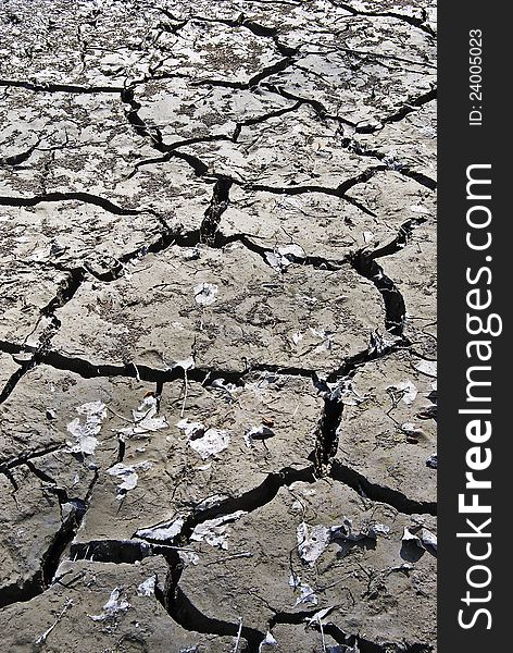 Wide angle close-up of clay soil cracked by drought. Wide angle close-up of clay soil cracked by drought.