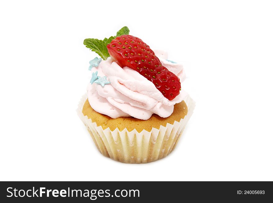 A small cake with cream on a white background. A small cake with cream on a white background
