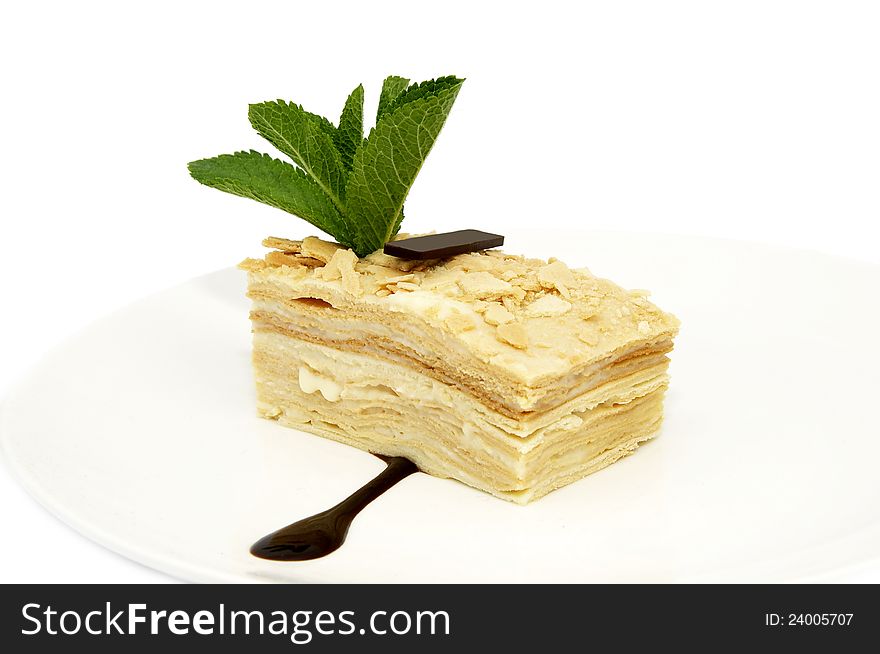 Layered dessert on a white background decorate with mint. Layered dessert on a white background decorate with mint