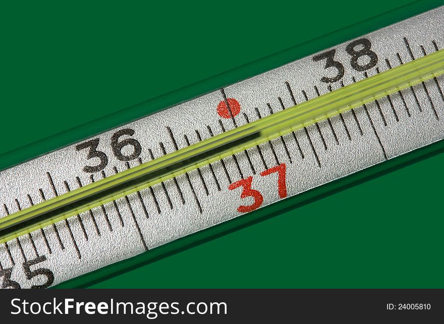 Medicine thermometer  on green background