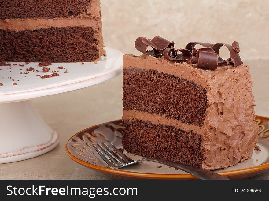 Piece of chocolate layer cake on a plate. Piece of chocolate layer cake on a plate