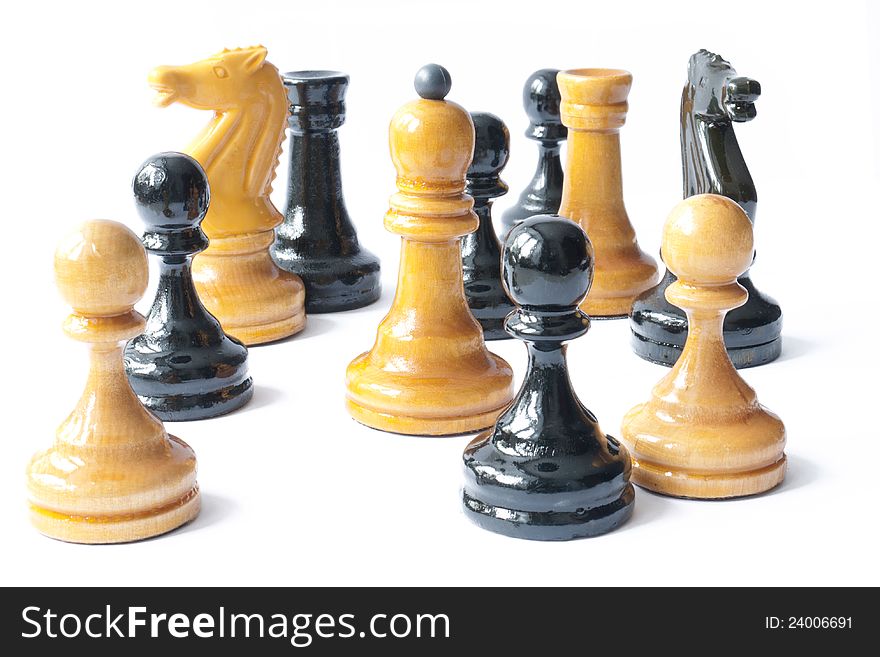 Black and white chess pieces of all values are together. Black and white chess pieces of all values are together.