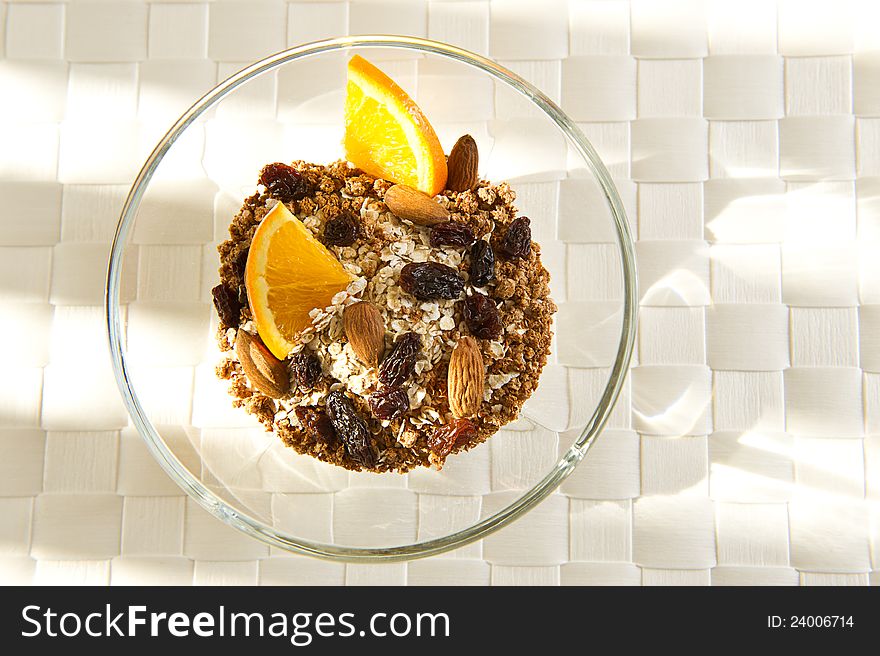 Healthy bowl of muesli with orange slices. Healthy bowl of muesli with orange slices.